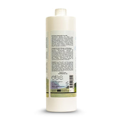 Close-up of Ever Ego Garlic Shampoo lather on hair strands.