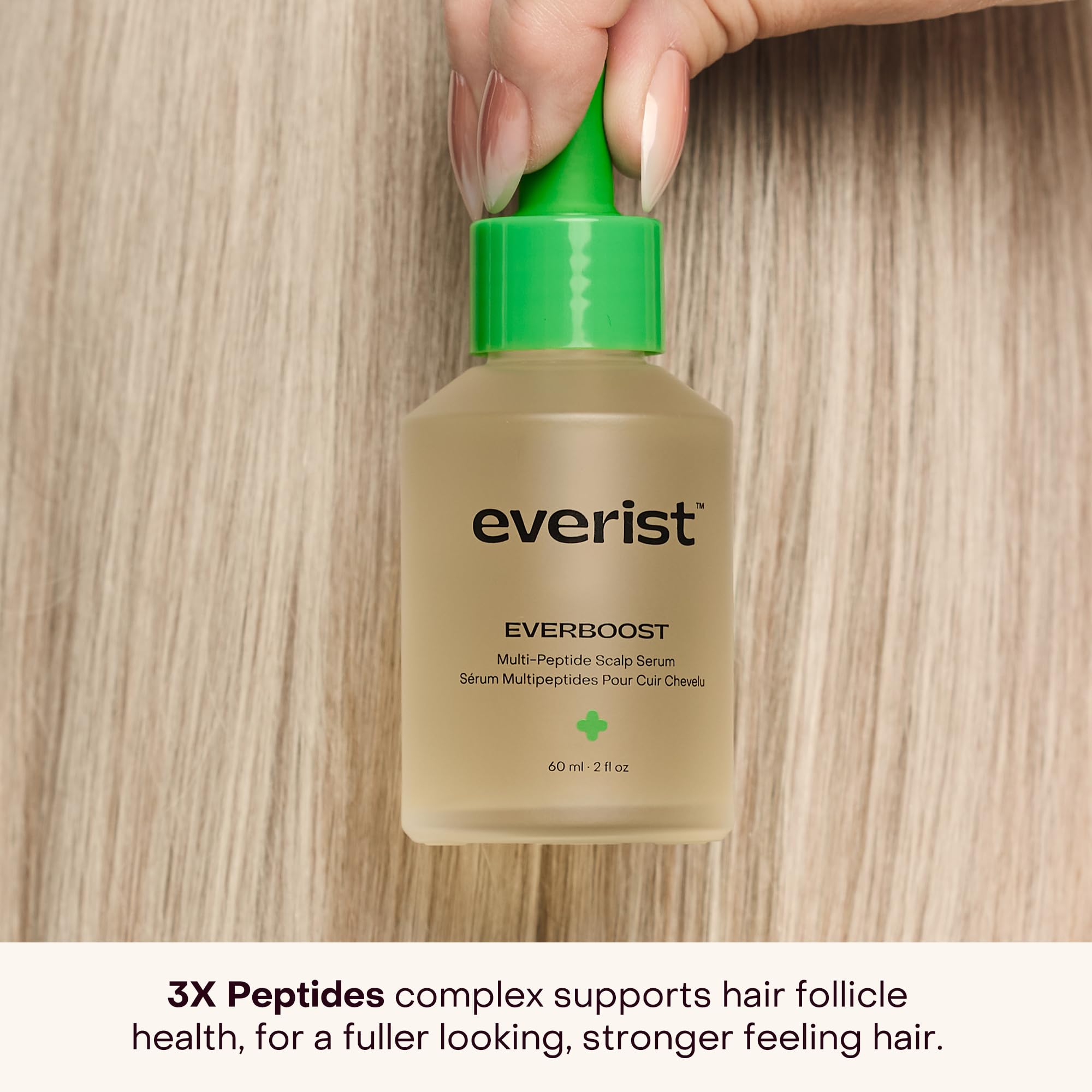 Application scene showing EverBoost being massaged into the scalp for potential nourishment.
