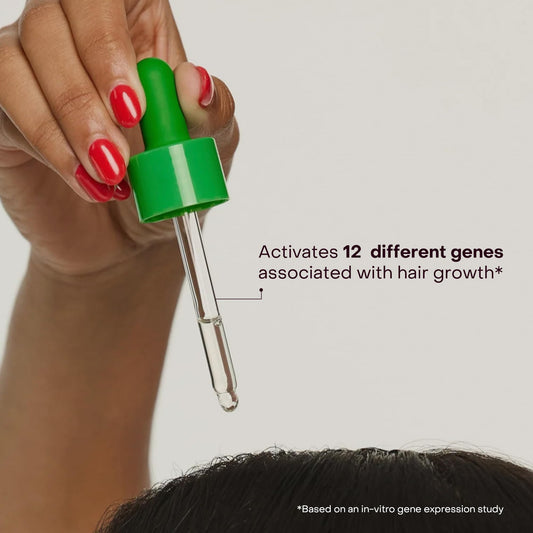 Close-up of EverBoost bottle pour for precise dosing and consistent scalp care.