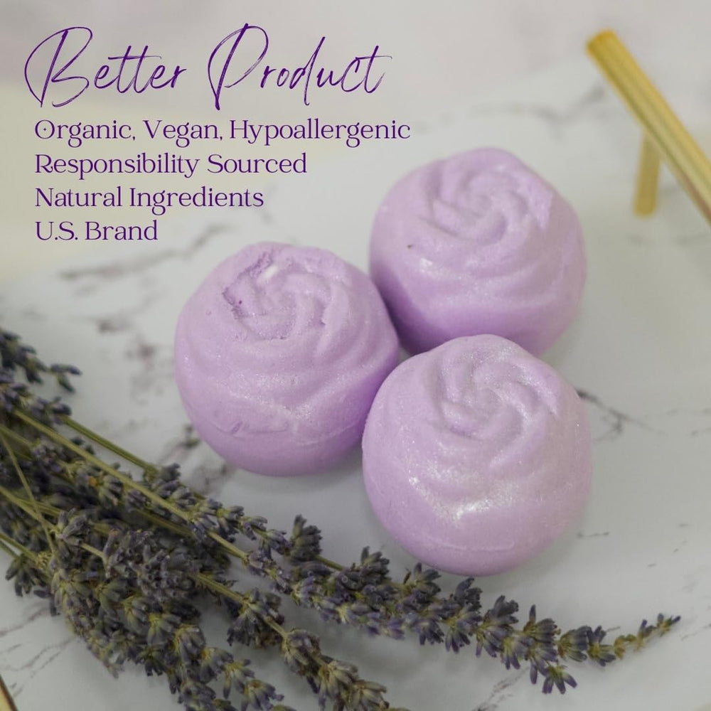 Lavender Dreams bath bomb dissolving, releasing fragrance and color in tub