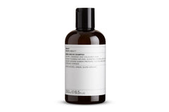 Evolve Organic Beauty Monoi Rescue Shampoo bottle pour demonstrates easy application and hydration