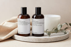 Evolve Organic Beauty Monoi Rescue Shampoo in-use on hair demonstrates nourishment and smoothness