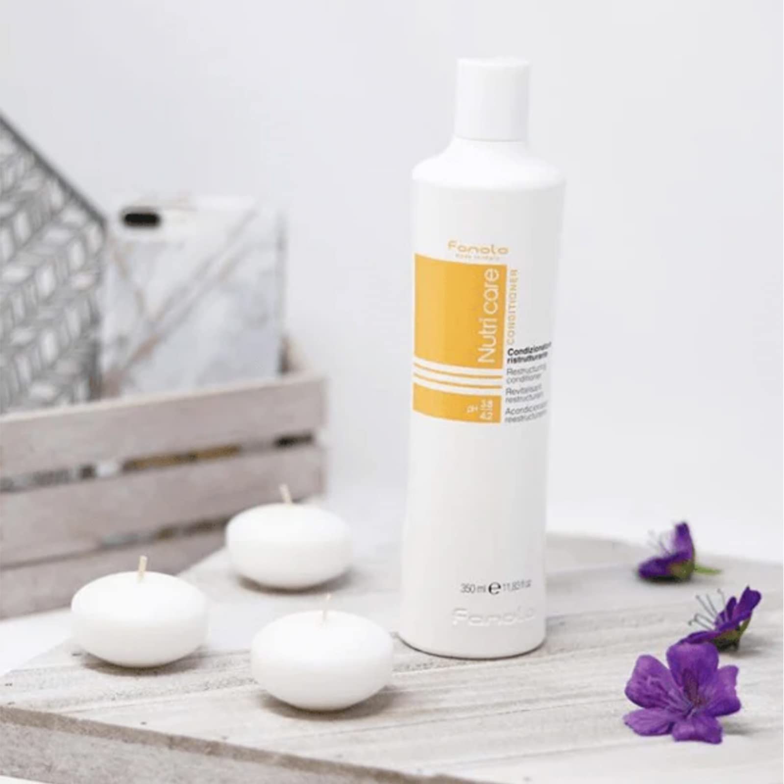Fanola No Yellow Shampoo packaging on salon shelf.