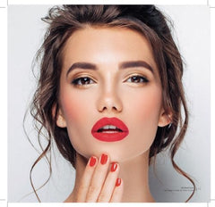 Doe-foot applicator applying precise lip color on lips.