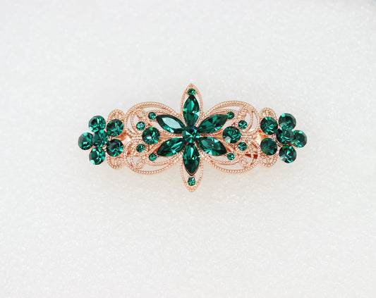 Faship emerald green rhinestone flora detail highlights elegant design.