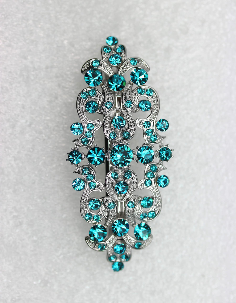 Faship Malibu blue-teal barrette side view with crystal details for elegant updos.