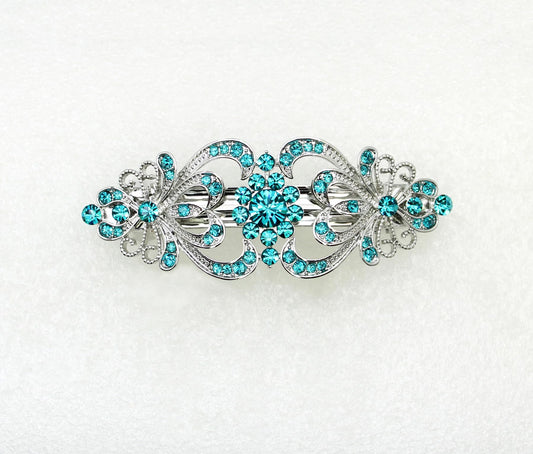 Faship teal rhinestone floral barrette enhances bridesmaid updo