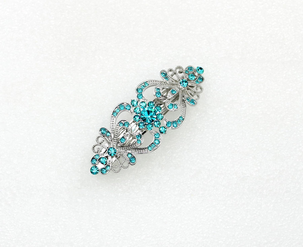 Faship teal rhinestone floral barrette close-up shimmer on hair