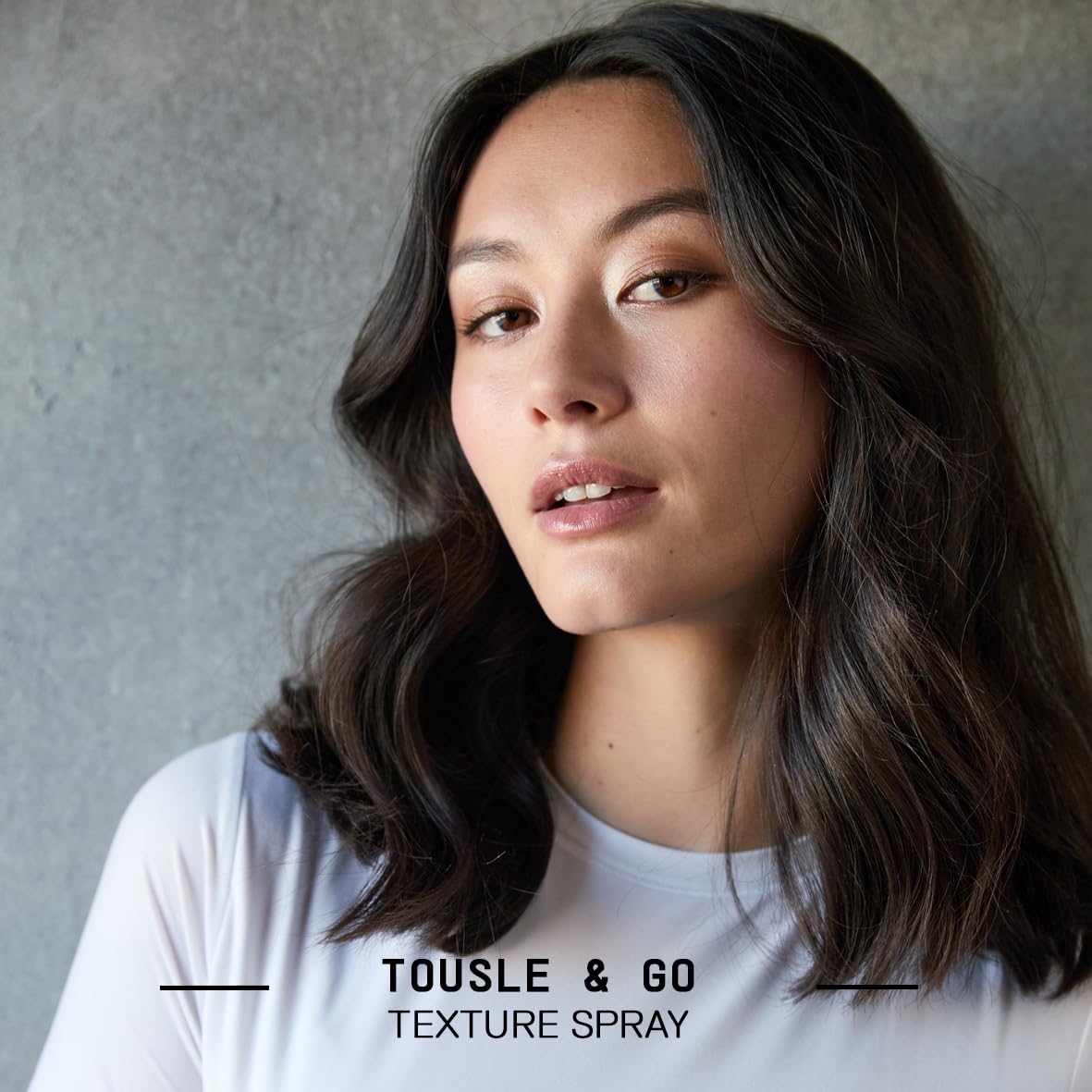 Fatboy Hair Tousle & Go mid-length texture spray showing versatile hold