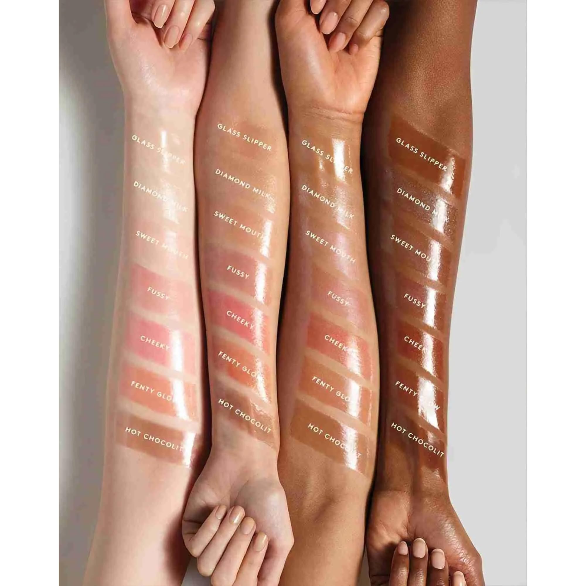 Close-up of Gloss Bomb lip luminizer application showing smooth glide.