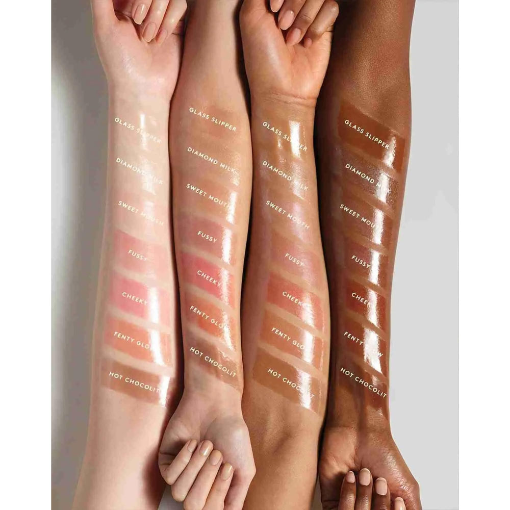 Close-up of Gloss Bomb lip luminizer application showing smooth glide.