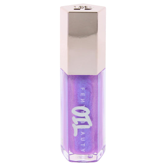 Fenty Beauty Gloss Bomb Miss Jellyfish applying gloss for smooth color.