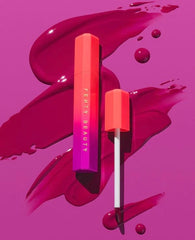 Fenty Beauty Poutsicle on lips shows vibrant glow with a soft tint.