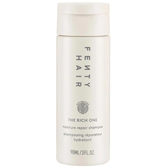 FENTY BEAUTY The Rich One Moisture Repair Shampoo mini bottle promotes softness and shine