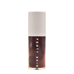 Close-up texture of Treatz lip oil showing clear cushiony hydration