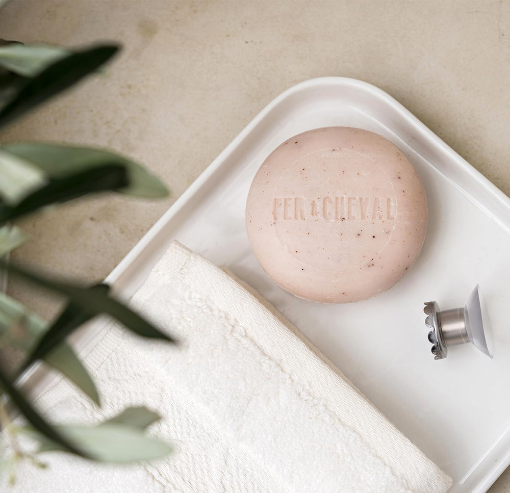 Fer à Cheval solid shampoo carries oat milk scent for soothing wash.
