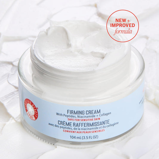 First Aid Beauty Firming Cream jar close-up reveals rich texture