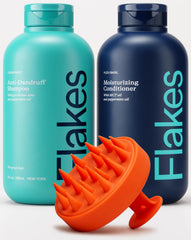Flakes anti-dandruff shampoo bottle with massager for refreshed scalp.