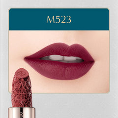 Swatch of FLORASIS Blooming Rouge Plum Royale on lips showing a misty matte finish