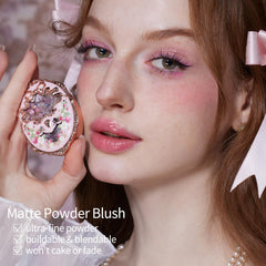Flower Knows embossed angel and strawberry motif on lid conveys luxury