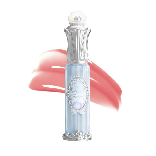 Flower Knows Shell Heart gloss swatch shows strawberry pink shade and shine.