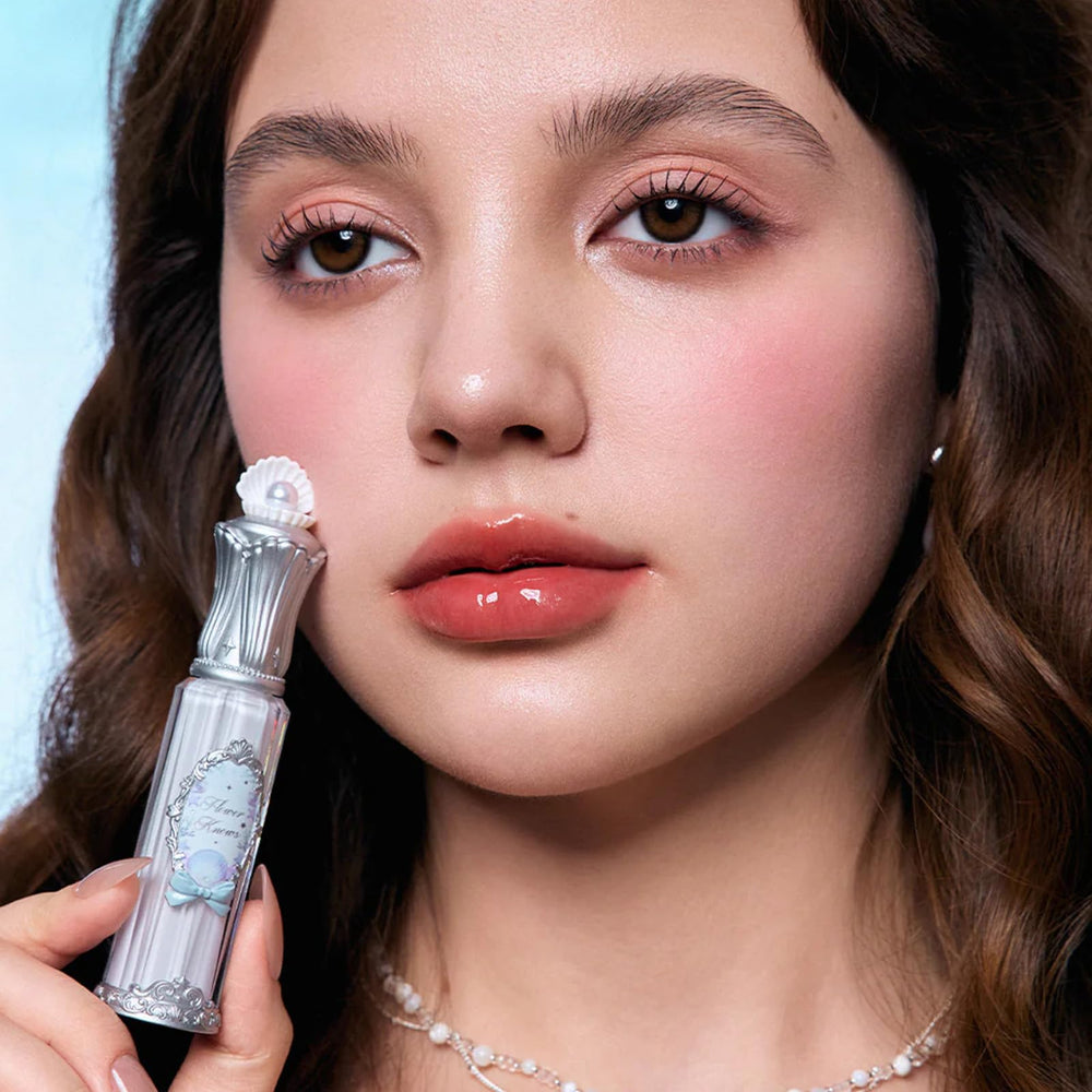Flower Knows Lip Glaze featuring meadowfoam seed oil for softness