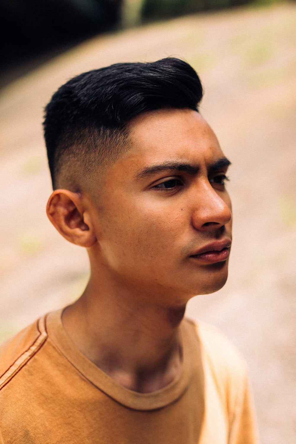 Floyd's 99 Grooming Grip Cream on model's hair with definition.