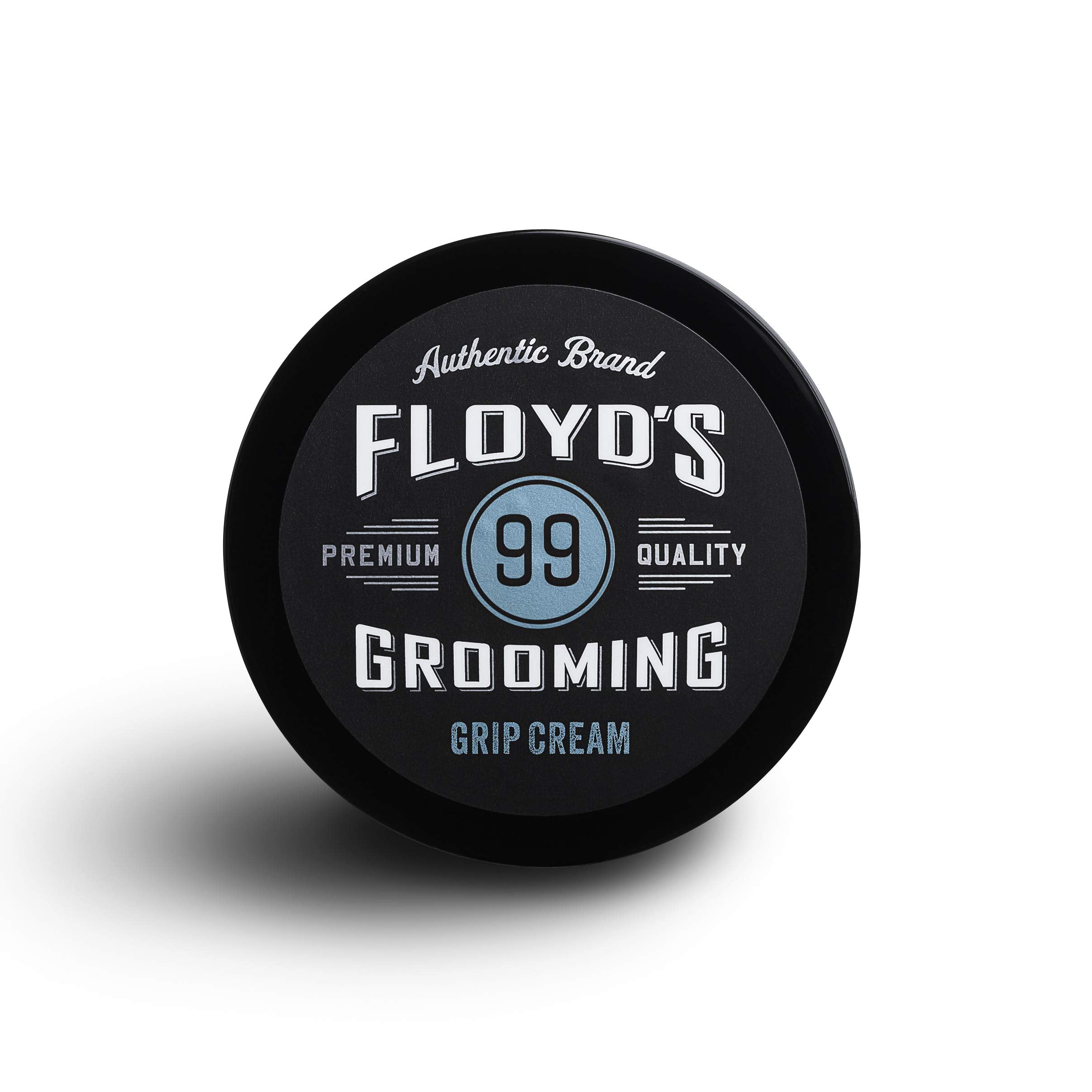 Floyd's 99 Grooming Grip Cream packaging close-up, travel-friendly design.