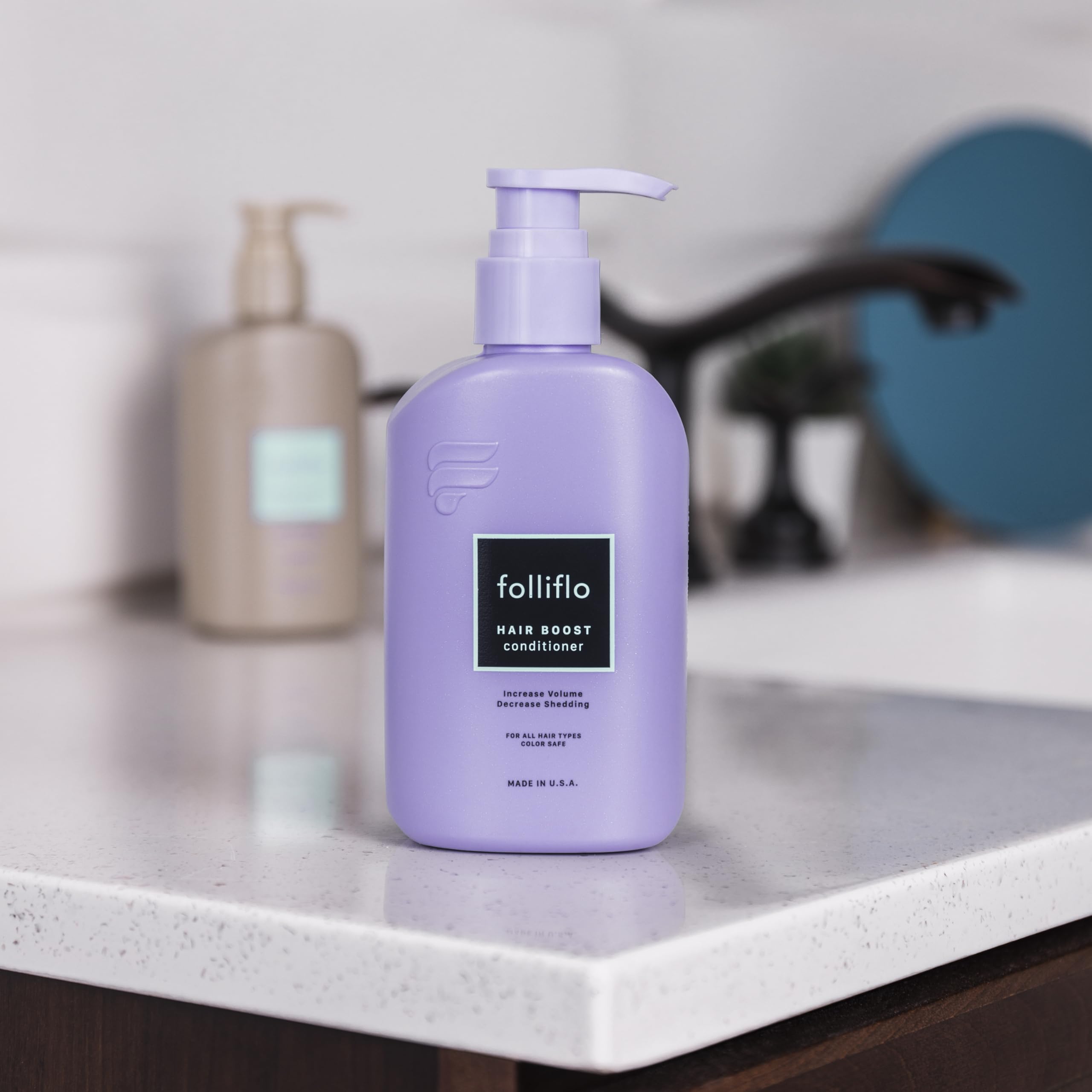 Folliflo bottle and pump illustrating controlled dispensing.
