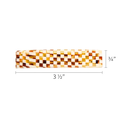 France Luxe checkered barrette worn in everyday hairstyle for a polished look.