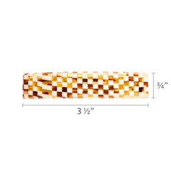 France Luxe checkered barrette worn in everyday hairstyle for a polished look.