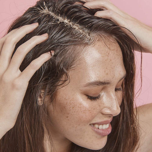 Close-up of Frank Body scalp scrub texture delivering gentle exfoliation.