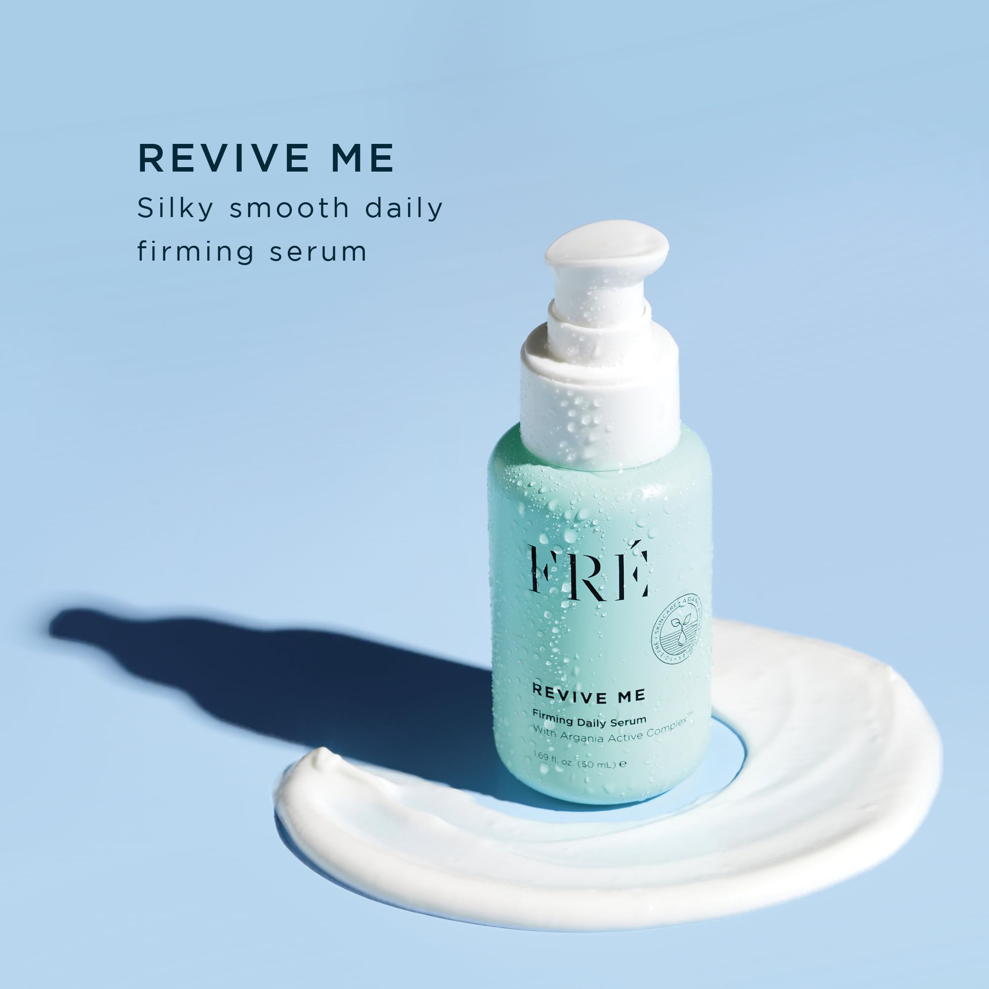 FRÉ Revive Me serum on hand, ready for easy daily application.