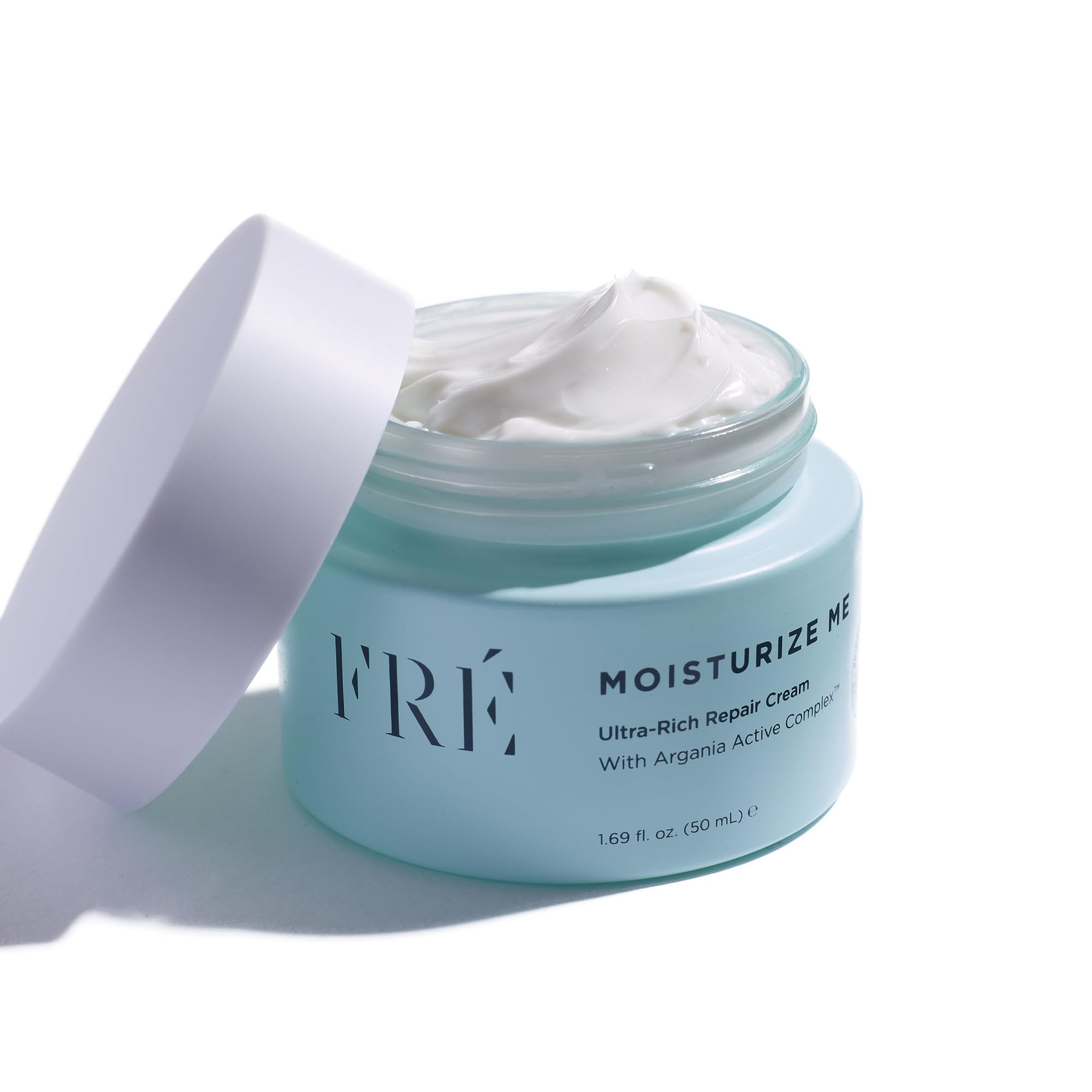FRÉ Ultra-Rich Repair Cream jar closeup showing creamy texture for instant hydration.