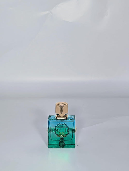 Sun Kissed turquoise glass bottle close-up highlighting premium bottle design