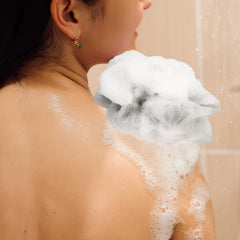 Close-up of Funnymoom mini pouf showing soft texture for gentle cleansing.