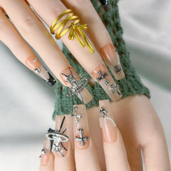 FURNUNUBI nails featuring 3D Saturn charms for celestial style and trendy flair.