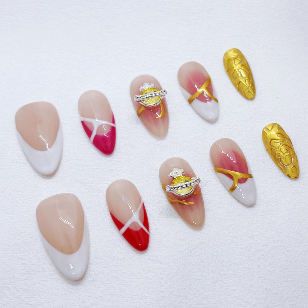 FURNUNUBI almond nails showcase Saturn jewel details for a stylish statement.