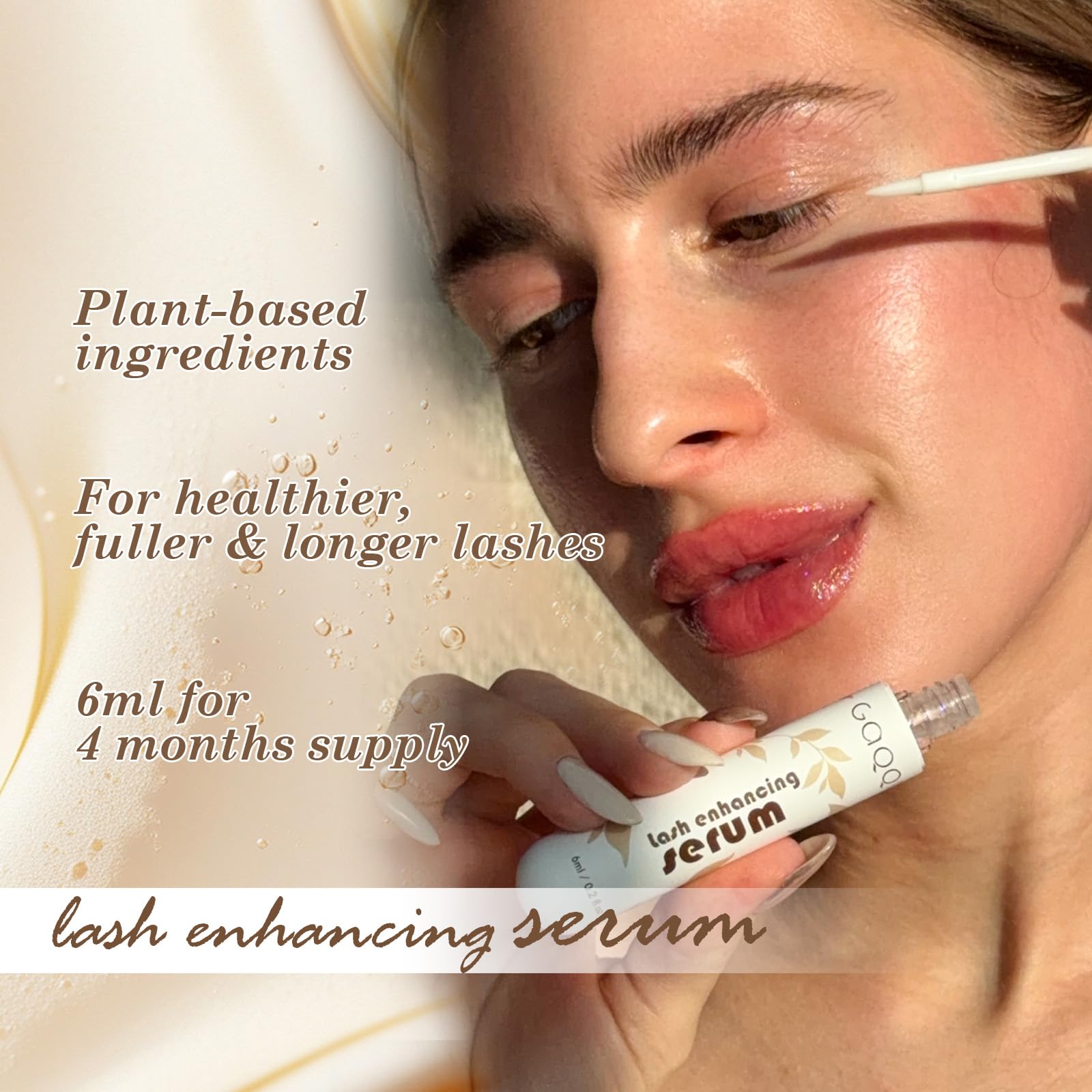 Close-up of GAQQI lash serum brush along the lash line for precise application.