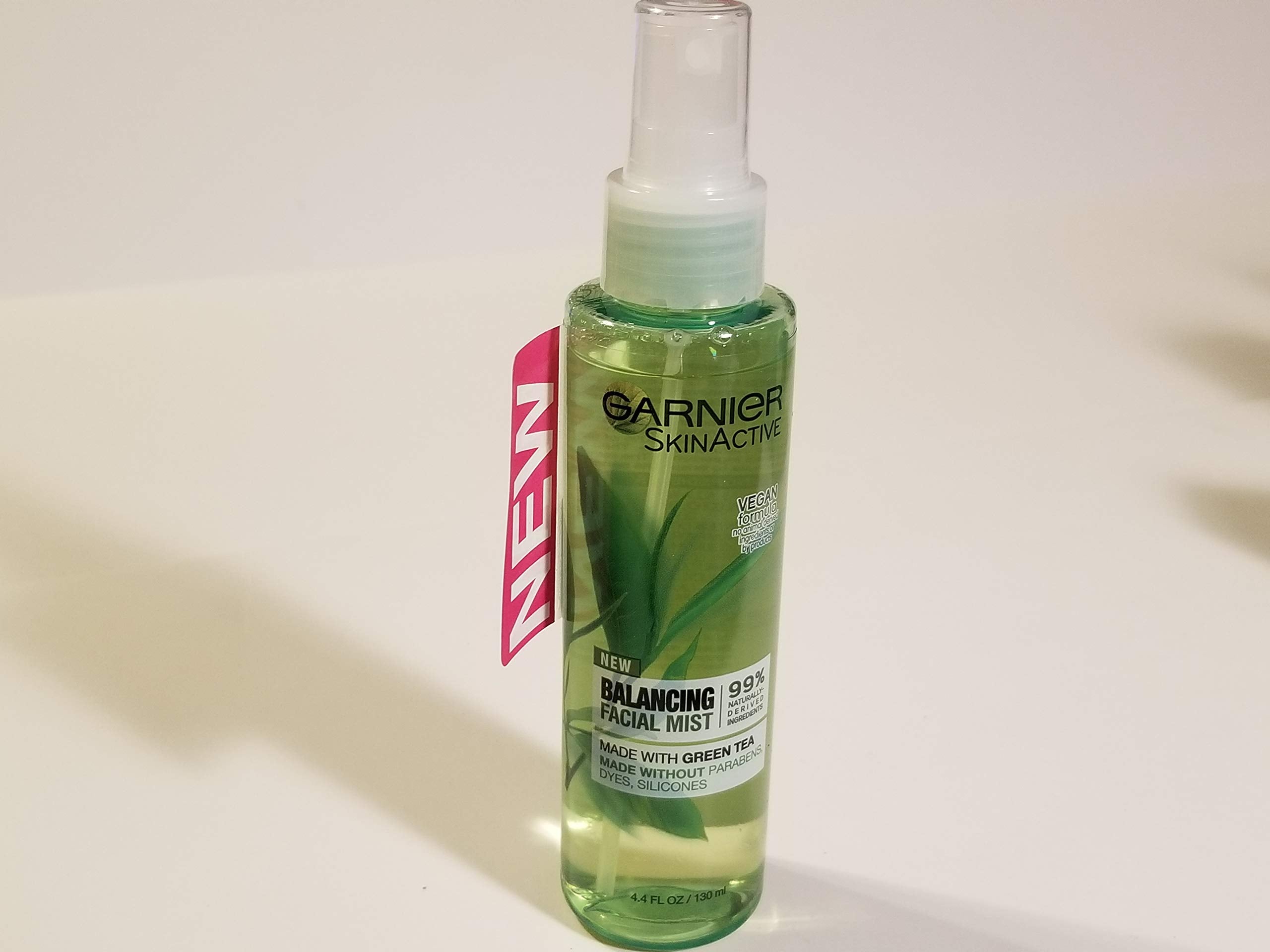 Garnier SkinActive Green Tea facial mist bottle pour delivers refreshing hydration.
