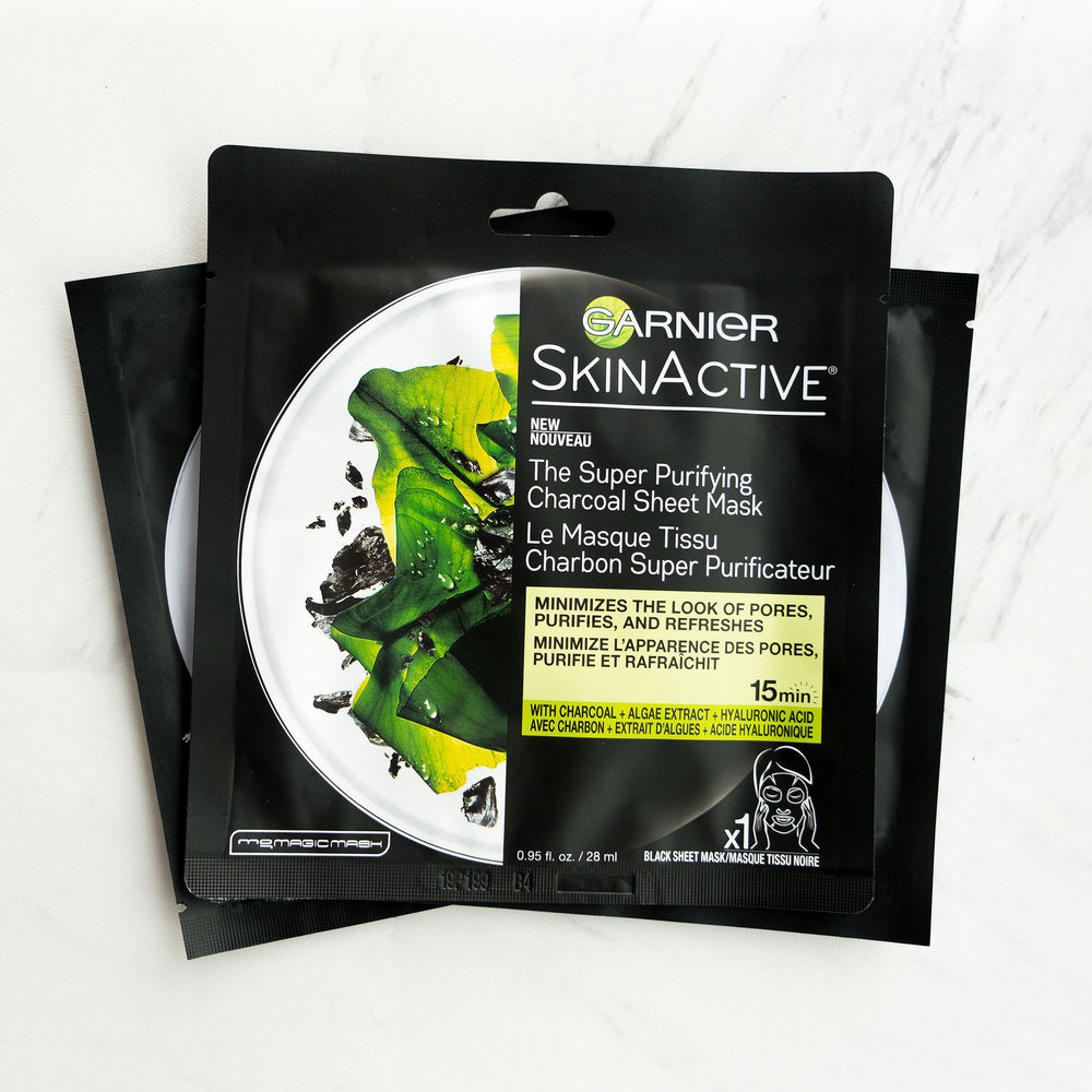Garnier SkinActive charcoal sheet mask close-up showing charcoal texture.