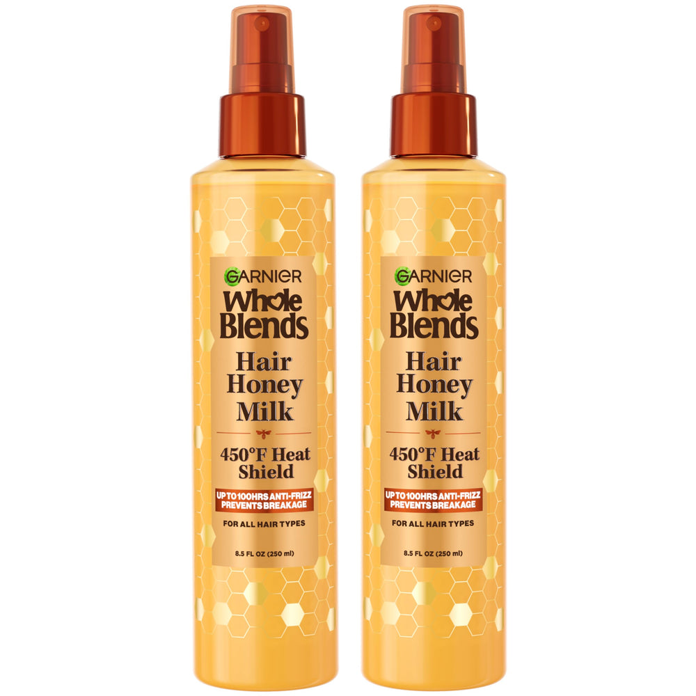 Garnier Whole Blends Honey Milk bottle with 450F heat protection for all hair types.