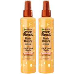 Garnier Whole Blends Honey Milk bottle with 450F heat protection for all hair types.