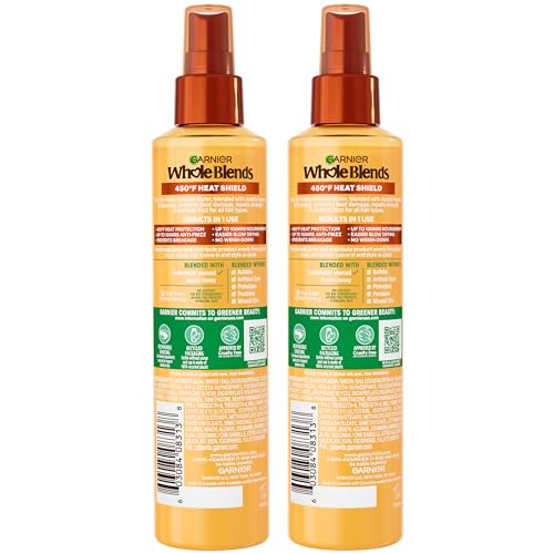 Garnier Honey Milk spray demonstrates even distribution on damp hair for frizz control.