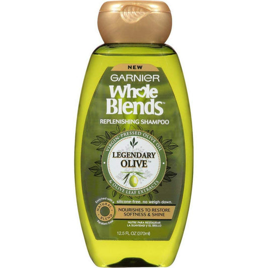 Garnier Whole Blends Legendary Olive shampoo bottle showing nourishing olive oil for dry hair.