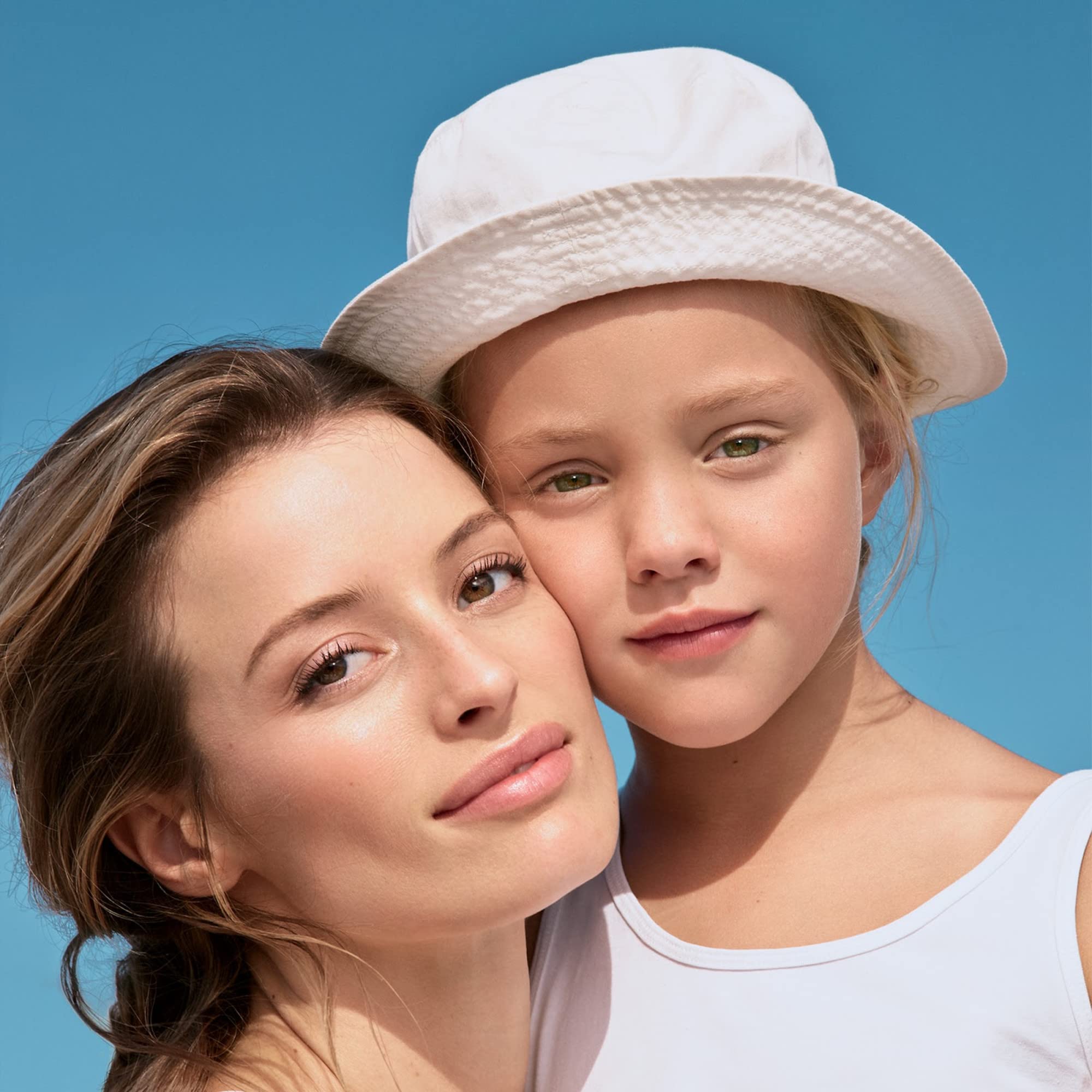 Ombrelle applied to skin on face and body for comprehensive protection.