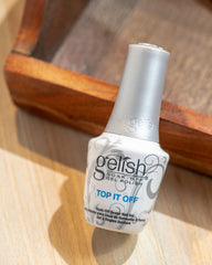 Gelish Top It Off application under LED light during cure for quick shine.