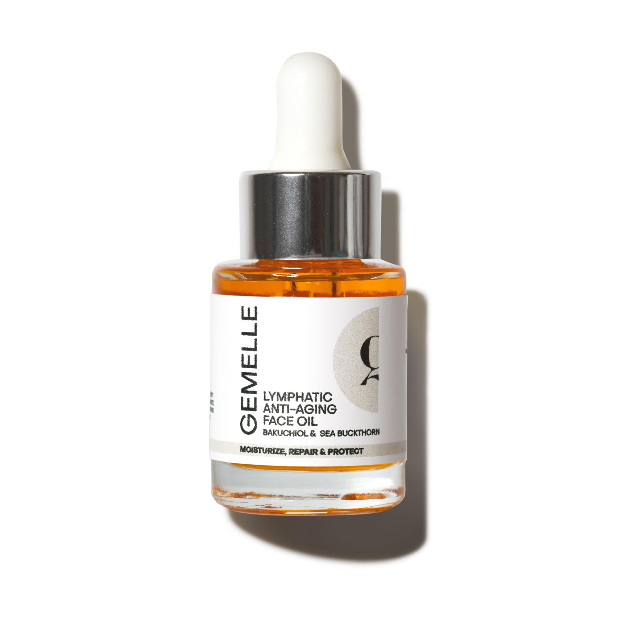 Gemelle Lymphatic Face Oil bottle pour for on-the-go hydration.