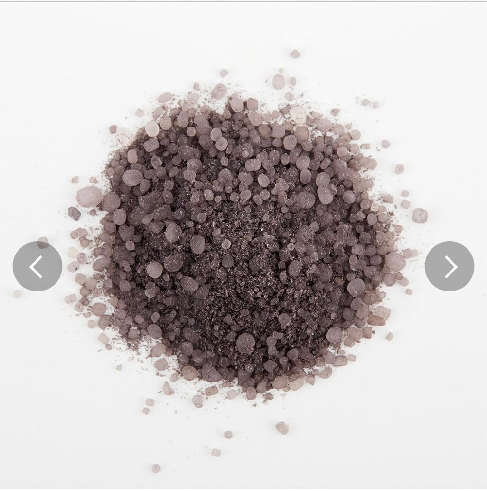 Generic bath salts dissolving in tub with orange scent, showing relaxing citrus benefit