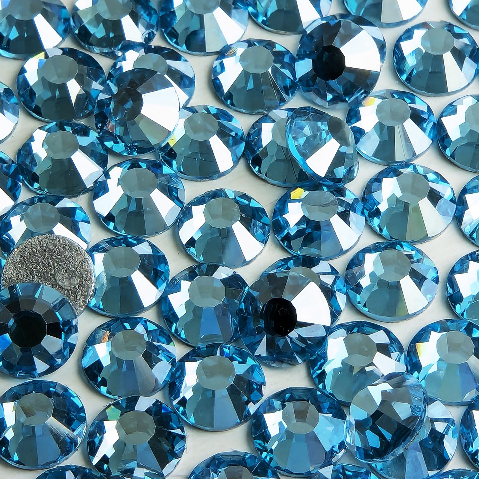 Genie Crystal nail art with Ice Aquamarine rhinestones for delicate accents.